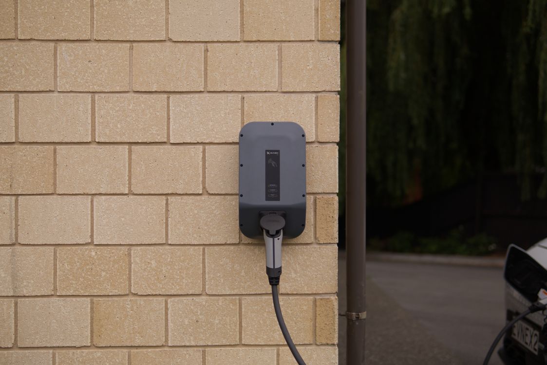 Stock photograph of a wall-mounted electric vehicle charger